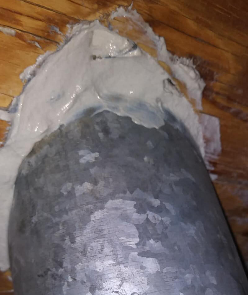 Family around a table counting the savings into a piggy bank